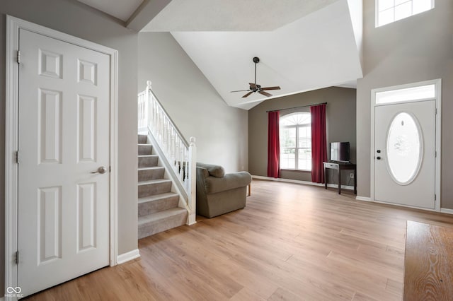 8365 Captain Dr, Avon, IN 46123 - entryway with stairs, ceiling fan, light wood-type flooring, and high vaulted ceiling