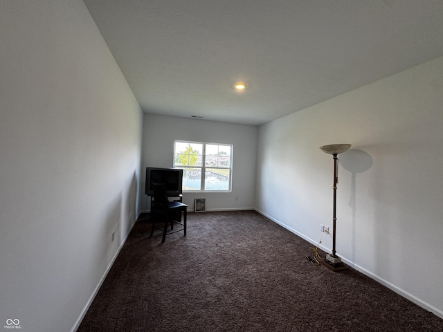 602 Tuscany Trl, Lapel, IN 46051 - sitting room featuring dark carpet and baseboards