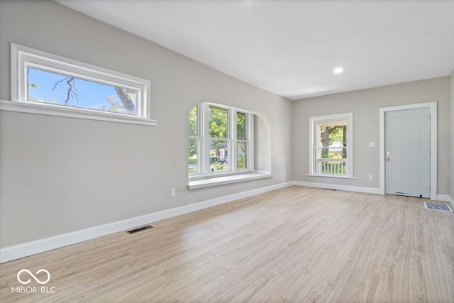 2813 S Monroe St, Muncie, IN 47302 - unfurnished living room featuring healthy amount of natural light, light wood-style flooring, and recessed lighting