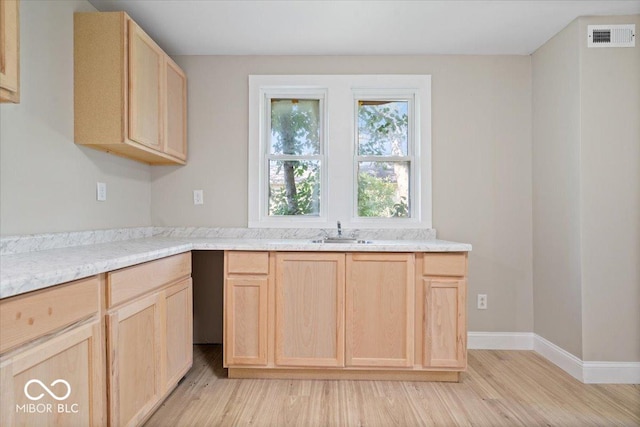 2813 S Monroe St, Muncie, IN 47302 - kitchen featuring light brown cabinetry and light wood-style flooring