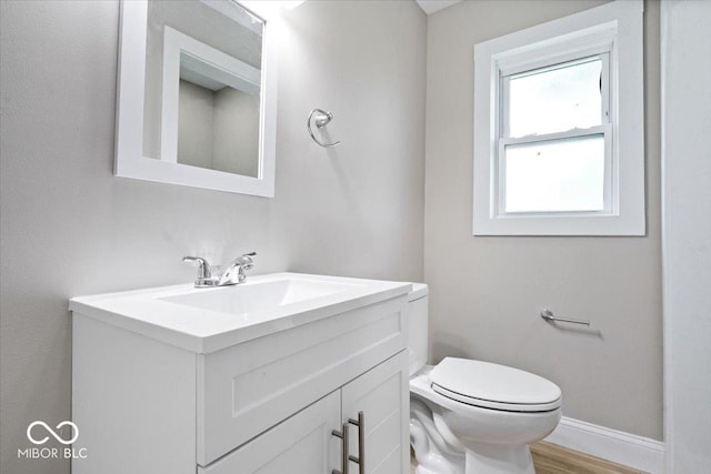 2813 S Monroe St, Muncie, IN 47302 - half bathroom with vanity and wood finished floors