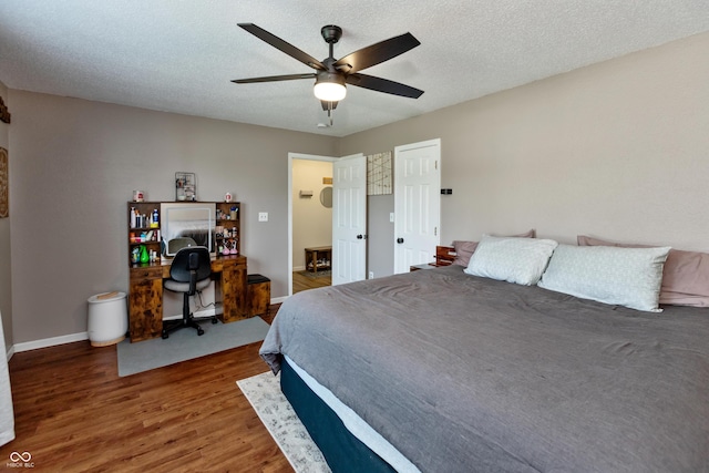 2082 Fiesbeck Dr, Columbus, IN 47201 - bedroom with wood finished floors, a desk, and ceiling fan