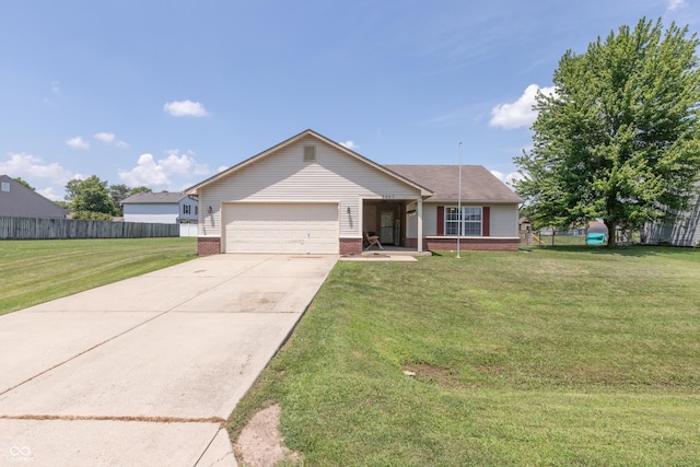 2082 Fiesbeck Dr, Columbus, IN 47201 - single story home with brick siding, a garage, and driveway