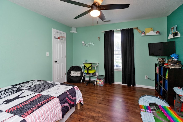 2082 Fiesbeck Dr, Columbus, IN 47201 - bedroom featuring wood finished floors, a ceiling fan, and a textured ceiling