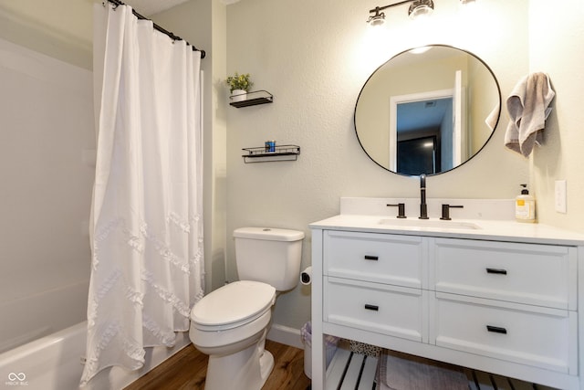 2082 Fiesbeck Dr, Columbus, IN 47201 - bathroom featuring vanity, wood finished floors, and shower / tub combo with curtain