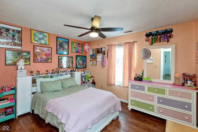 2082 Fiesbeck Dr, Columbus, IN 47201 - bedroom with wood finished floors, a ceiling fan, and a textured ceiling