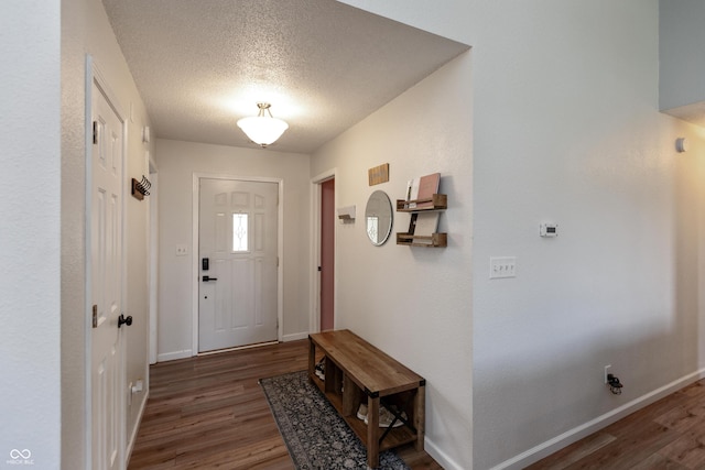 2082 Fiesbeck Dr, Columbus, IN 47201 - entryway with wood finished floors and a textured ceiling
