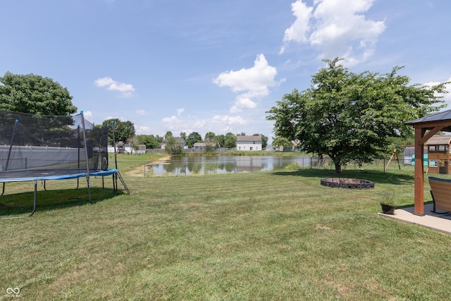 2082 Fiesbeck Dr, Columbus, IN 47201 - view of green lawn with a trampoline, a water view, and a gazebo