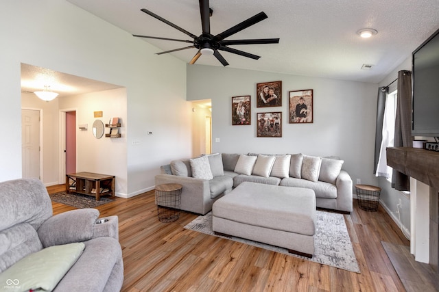2082 Fiesbeck Dr, Columbus, IN 47201 - living area with a ceiling fan, vaulted ceiling, and wood finished floors