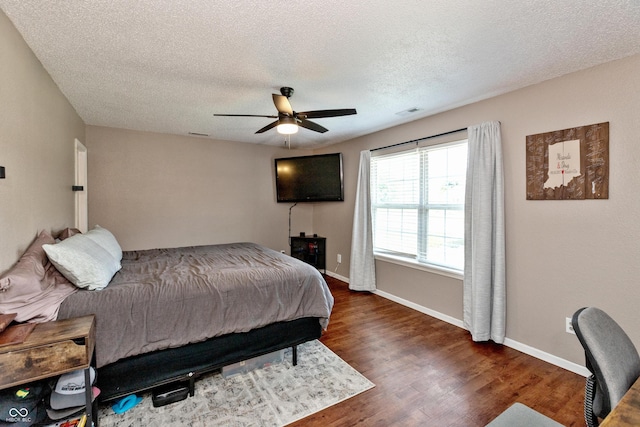 2082 Fiesbeck Dr, Columbus, IN 47201 - bedroom with wood finished floors, a textured ceiling, and a ceiling fan