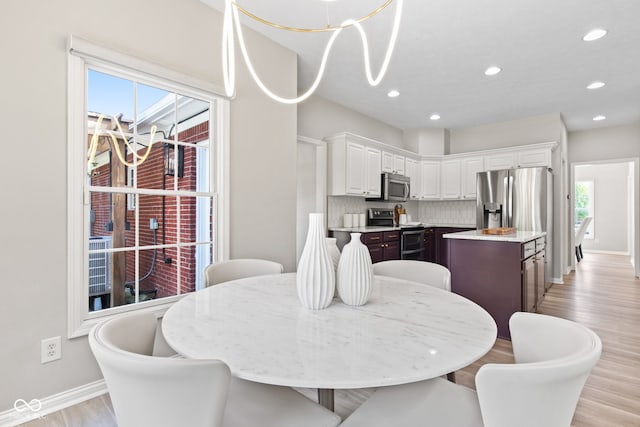 5910 Hickory Woods Dr, Plainfield, IN 46168 - dining space featuring recessed lighting and light wood-type flooring