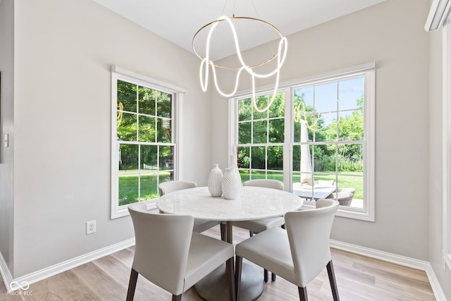 5910 Hickory Woods Dr, Plainfield, IN 46168 - dining area with light wood-style floors and a chandelier