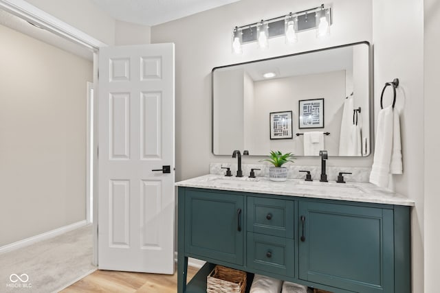 5910 Hickory Woods Dr, Plainfield, IN 46168 - bathroom with double vanity and wood finished floors