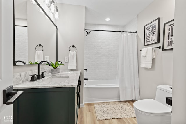 5910 Hickory Woods Dr, Plainfield, IN 46168 - bathroom featuring wood finished floors, vanity, and shower / tub combo with curtain