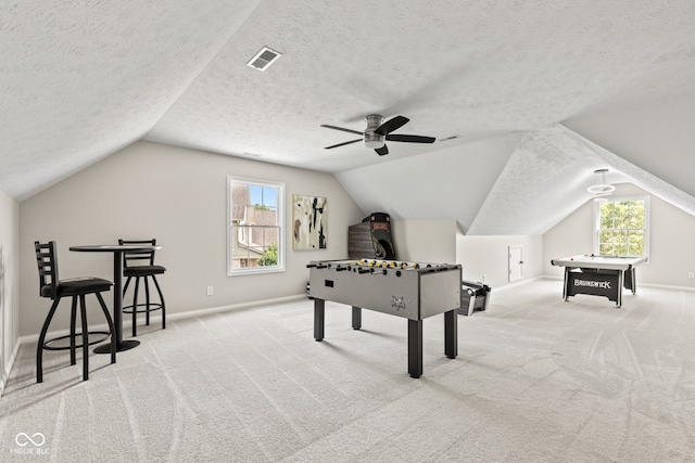 5910 Hickory Woods Dr, Plainfield, IN 46168 - recreation room featuring ceiling fan, carpet floors, lofted ceiling, plenty of natural light, and a textured ceiling