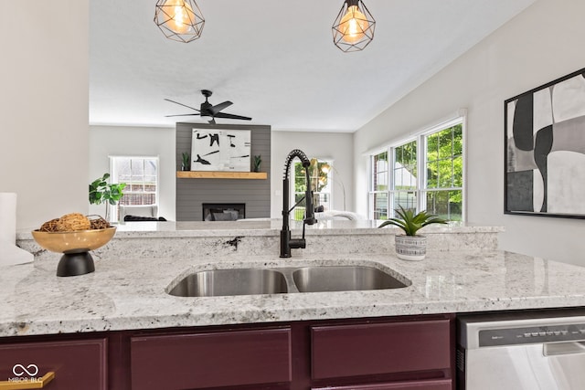 5910 Hickory Woods Dr, Plainfield, IN 46168 - kitchen with dishwasher, light stone counters, a large fireplace, and open floor plan