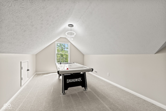 5910 Hickory Woods Dr, Plainfield, IN 46168 - rec room featuring a textured ceiling, vaulted ceiling, and carpet floors