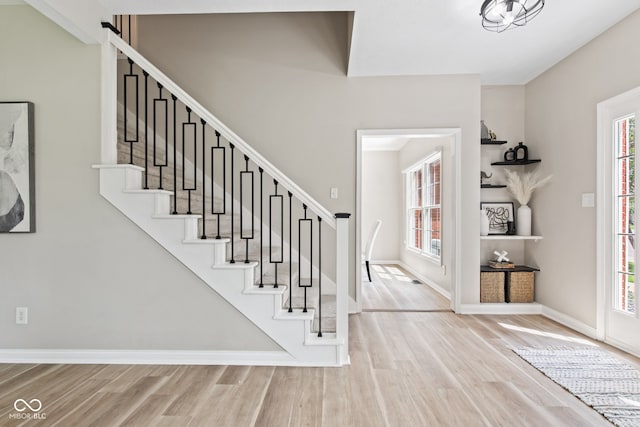 5910 Hickory Woods Dr, Plainfield, IN 46168 - foyer featuring plenty of natural light, wood finished floors, and stairway