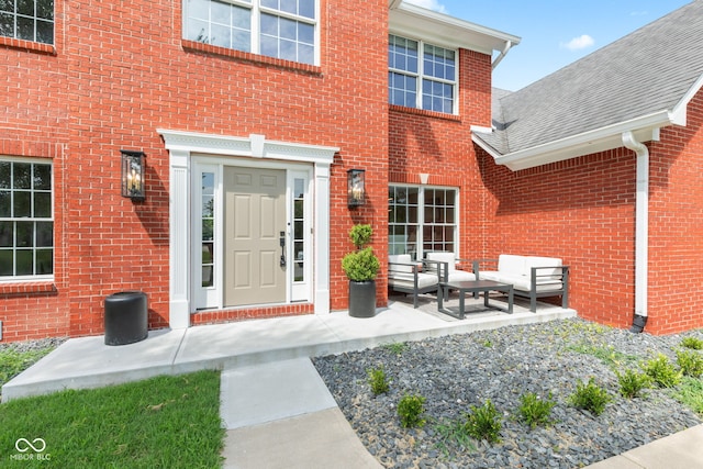 5910 Hickory Woods Dr, Plainfield, IN 46168 - doorway to property with outdoor lounge area, brick siding, and roof with shingles
