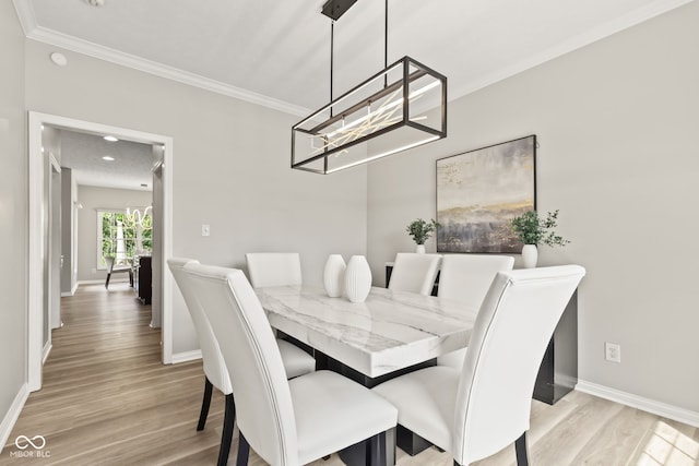 5910 Hickory Woods Dr, Plainfield, IN 46168 - dining area featuring a chandelier, wood finished floors, and crown molding