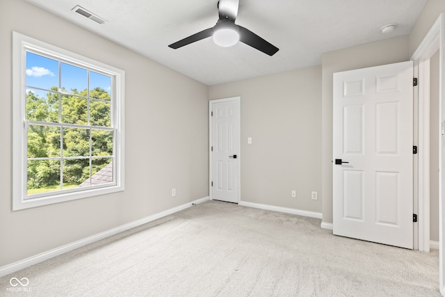 5910 Hickory Woods Dr, Plainfield, IN 46168 - unfurnished bedroom with light colored carpet and a ceiling fan