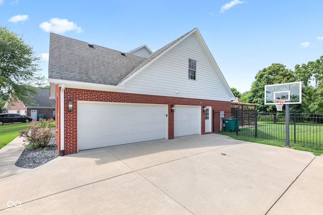 5910 Hickory Woods Dr, Plainfield, IN 46168 - view of home's exterior with brick siding, roof with shingles, and driveway