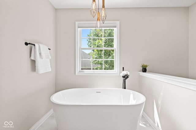 5910 Hickory Woods Dr, Plainfield, IN 46168 - full bathroom with marble look tiles and a freestanding bath
