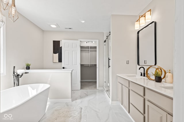 5910 Hickory Woods Dr, Plainfield, IN 46168 - full bath featuring marble look tiles, a soaking tub, double vanity, a spacious closet, and a shower with door
