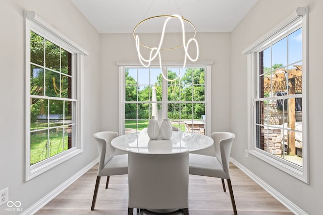 5910 Hickory Woods Dr, Plainfield, IN 46168 - dining area featuring a chandelier and light wood-style floors