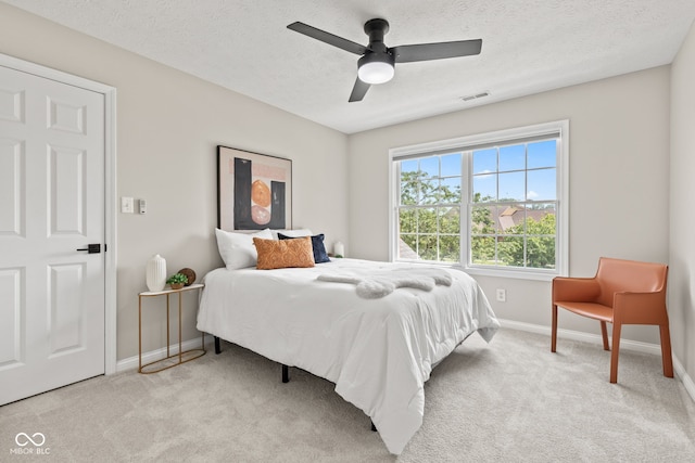 5910 Hickory Woods Dr, Plainfield, IN 46168 - bedroom with light carpet, a ceiling fan, and a textured ceiling