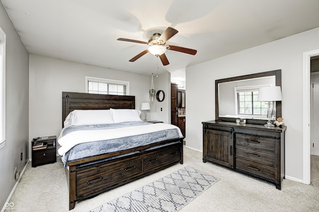 2206 Boston Ct Unit B, Indianapolis, IN 46228 - bedroom featuring light colored carpet, connected bathroom, and a ceiling fan