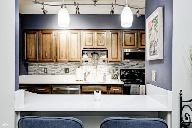 2206 Boston Ct Unit B, Indianapolis, IN 46228 - kitchen with stainless steel appliances, decorative backsplash, and light countertops