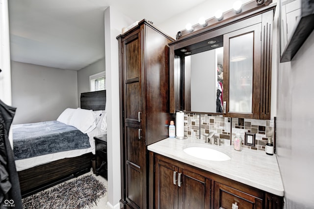 2206 Boston Ct Unit B, Indianapolis, IN 46228 - bathroom with vanity and decorative backsplash