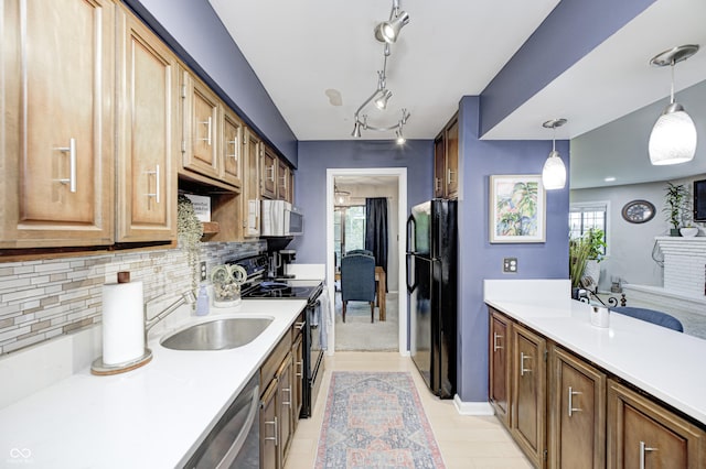 2206 Boston Ct Unit B, Indianapolis, IN 46228 - kitchen with black appliances, light countertops, decorative backsplash, and pendant lighting