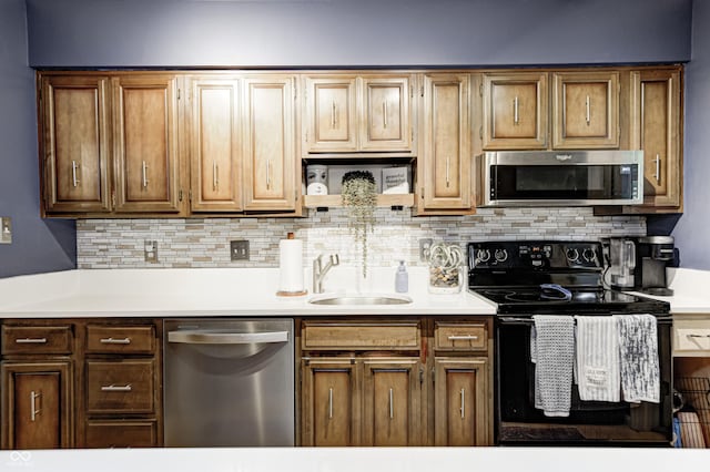2206 Boston Ct Unit B, Indianapolis, IN 46228 - kitchen with appliances with stainless steel finishes, light countertops, and backsplash