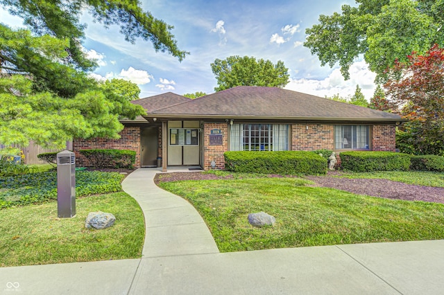 2206 Boston Ct Unit B, Indianapolis, IN 46228 - view of front facade featuring brick siding, a front lawn, and a shingled roof