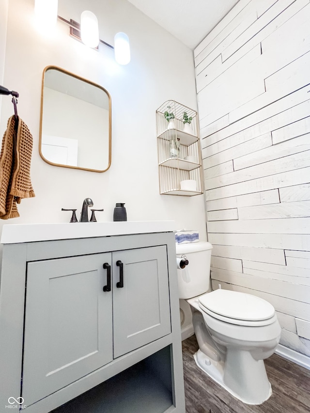 258 Center Ln, Crawfordsville, IN 47933 - half bath featuring wood finished floors, wood walls, and vanity