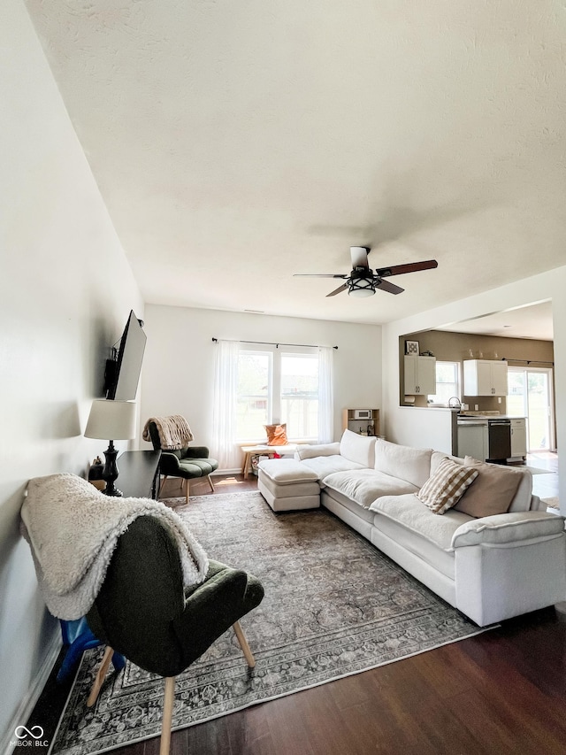 258 Center Ln, Crawfordsville, IN 47933 - living area with dark wood-style flooring, ceiling fan, and healthy amount of natural light