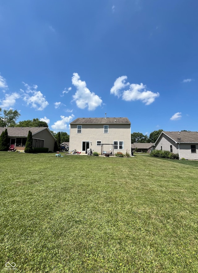 258 Center Ln, Crawfordsville, IN 47933 - rear view of property featuring a yard