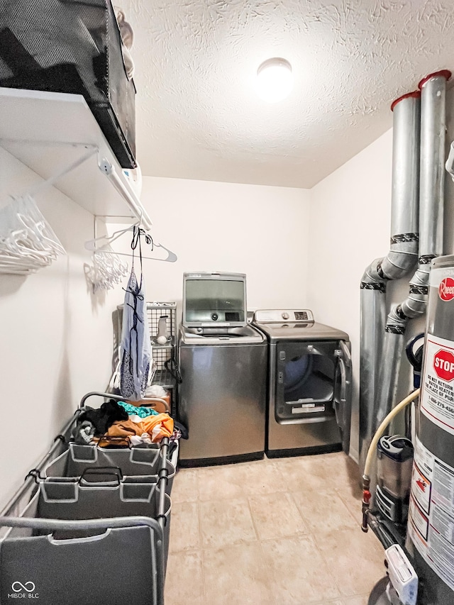 258 Center Ln, Crawfordsville, IN 47933 - washroom featuring washing machine and clothes dryer and a textured ceiling