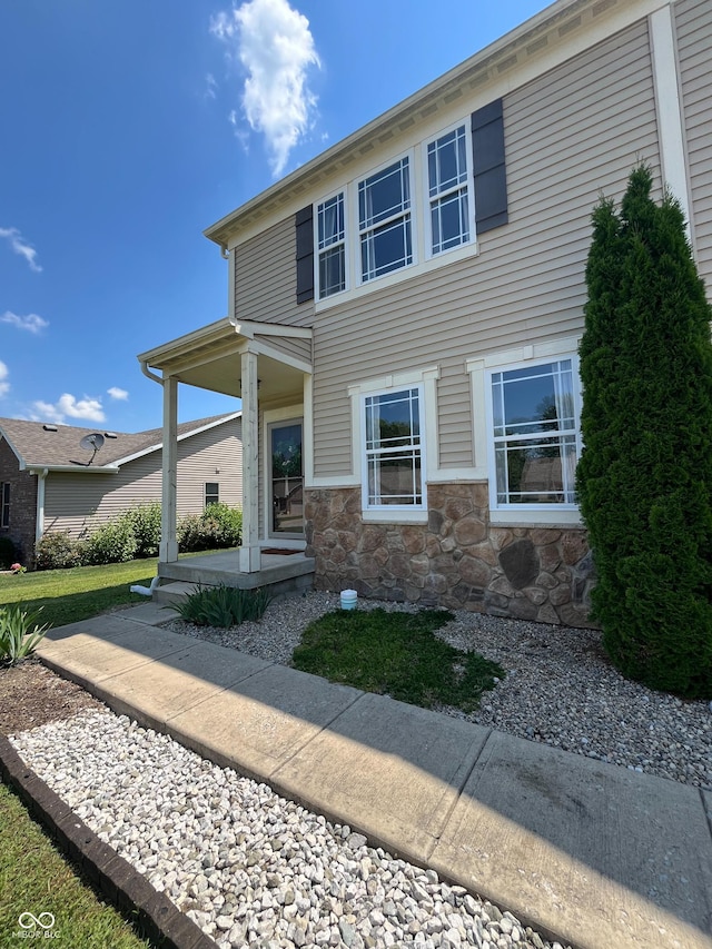 258 Center Ln, Crawfordsville, IN 47933 - view of front of home featuring stone siding and a porch
