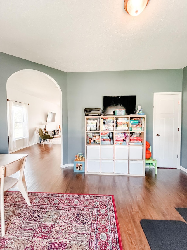 258 Center Ln, Crawfordsville, IN 47933 - living room with arched walkways and wood finished floors