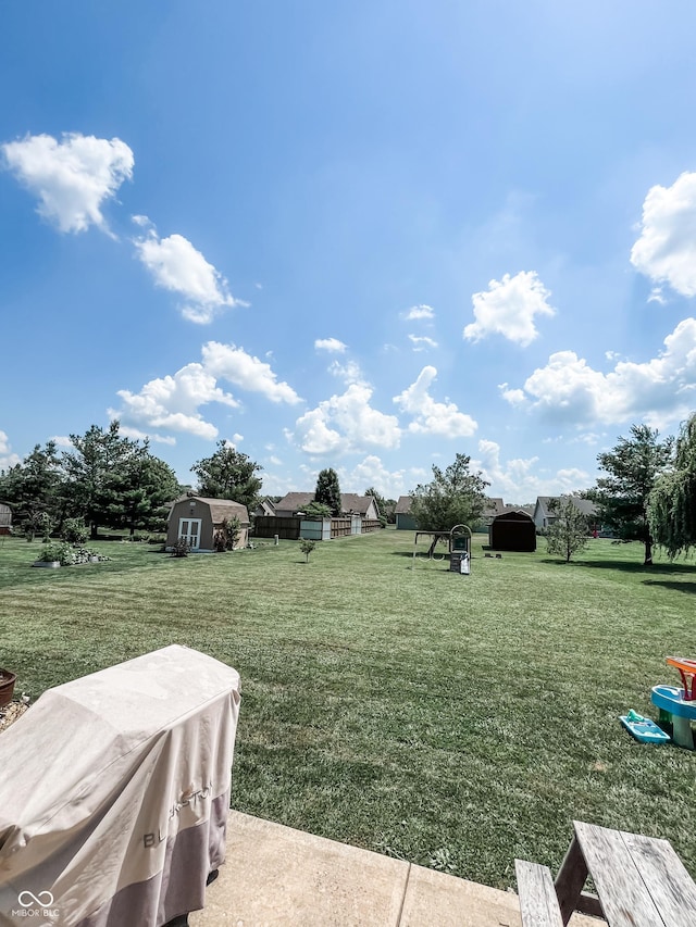 258 Center Ln, Crawfordsville, IN 47933 - view of green lawn featuring a storage shed