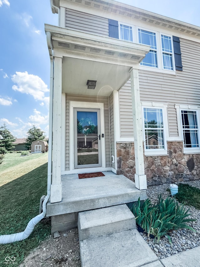 258 Center Ln, Crawfordsville, IN 47933 - doorway to property with stone siding and a lawn