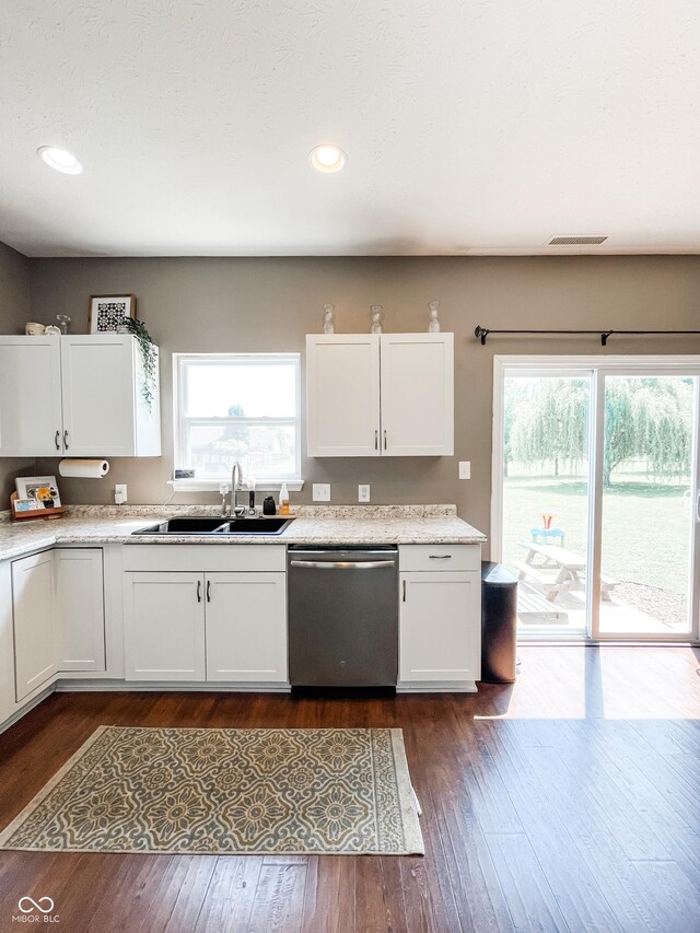 258 Center Ln, Crawfordsville, IN 47933 - kitchen featuring dishwasher, white cabinetry, light countertops, dark wood-type flooring, and recessed lighting
