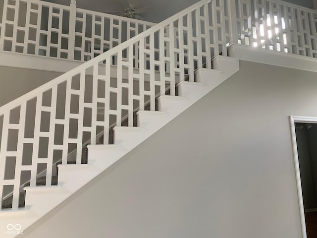 9532 Pinecreek Dr, Indianapolis, IN 46256 - stairway featuring a high ceiling and ceiling fan