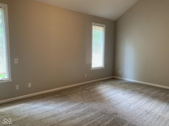 9532 Pinecreek Dr, Indianapolis, IN 46256 - carpeted spare room featuring baseboards and lofted ceiling