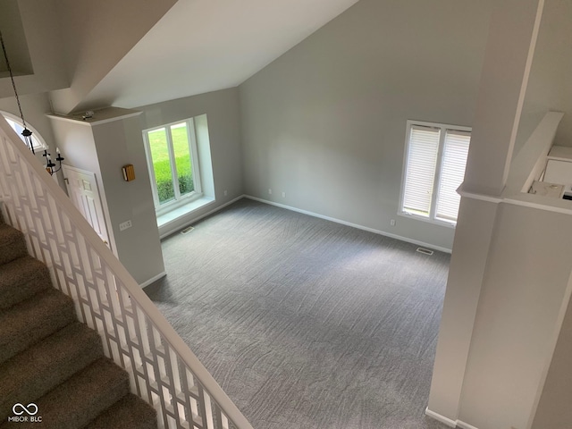 9532 Pinecreek Dr, Indianapolis, IN 46256 - stairs with carpet floors and vaulted ceiling