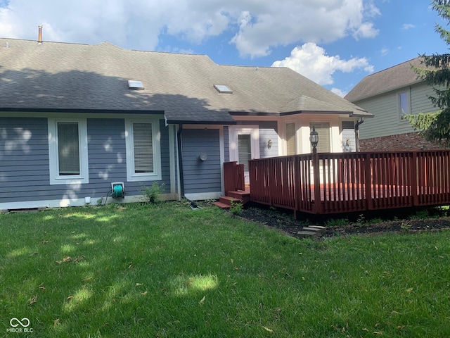 9532 Pinecreek Dr, Indianapolis, IN 46256 - back of house with a deck, a lawn, and roof with shingles
