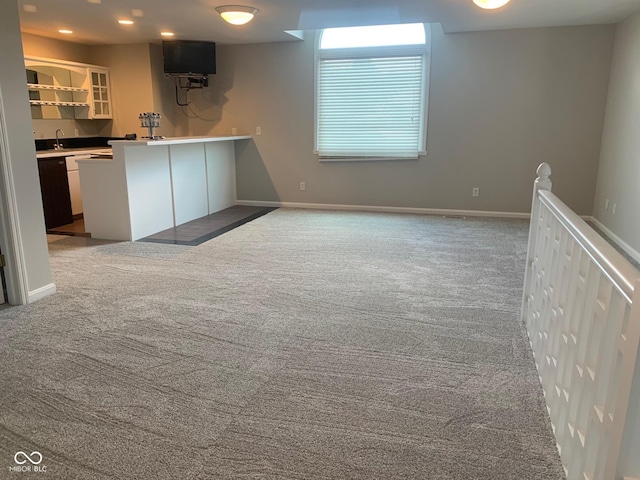 9532 Pinecreek Dr, Indianapolis, IN 46256 - kitchen featuring carpet flooring, glass insert cabinets, and a peninsula